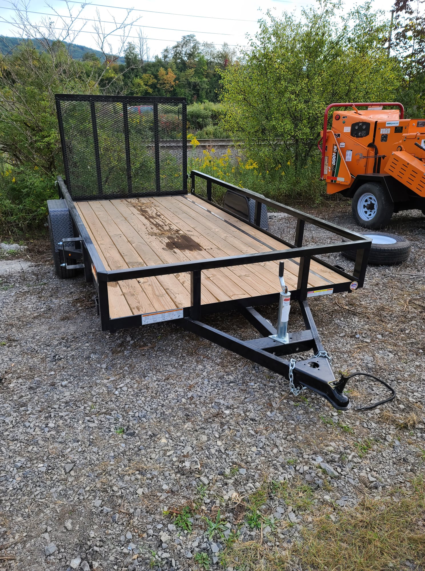 A towable landscape trailer ready to be pulled away for the next job. 